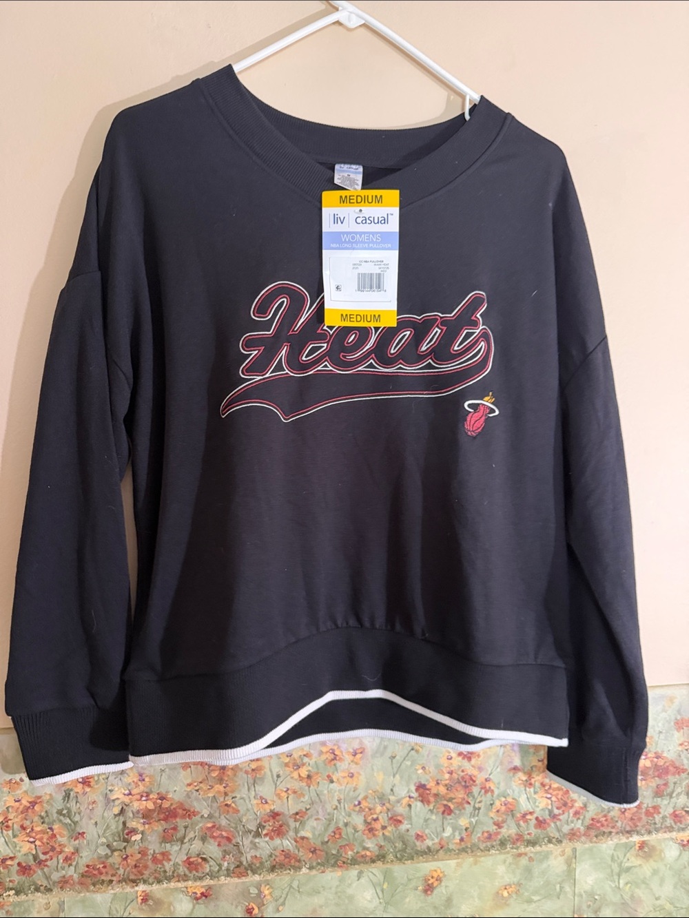 NBA Black Sweatshirt with Red and White 'Heat' Script
Miami Heat basketball team